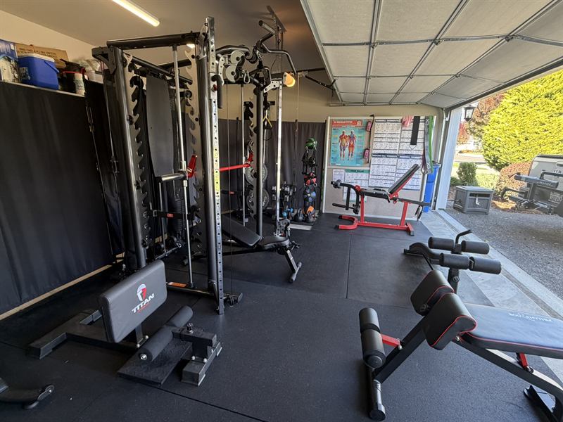 The studio with the garage door open to natural light